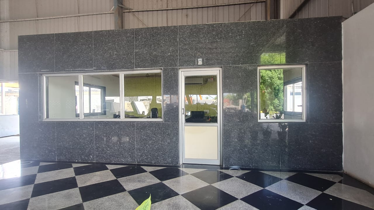 Hariom Granite Industries office, its walls clad in polished Steel Grey granite